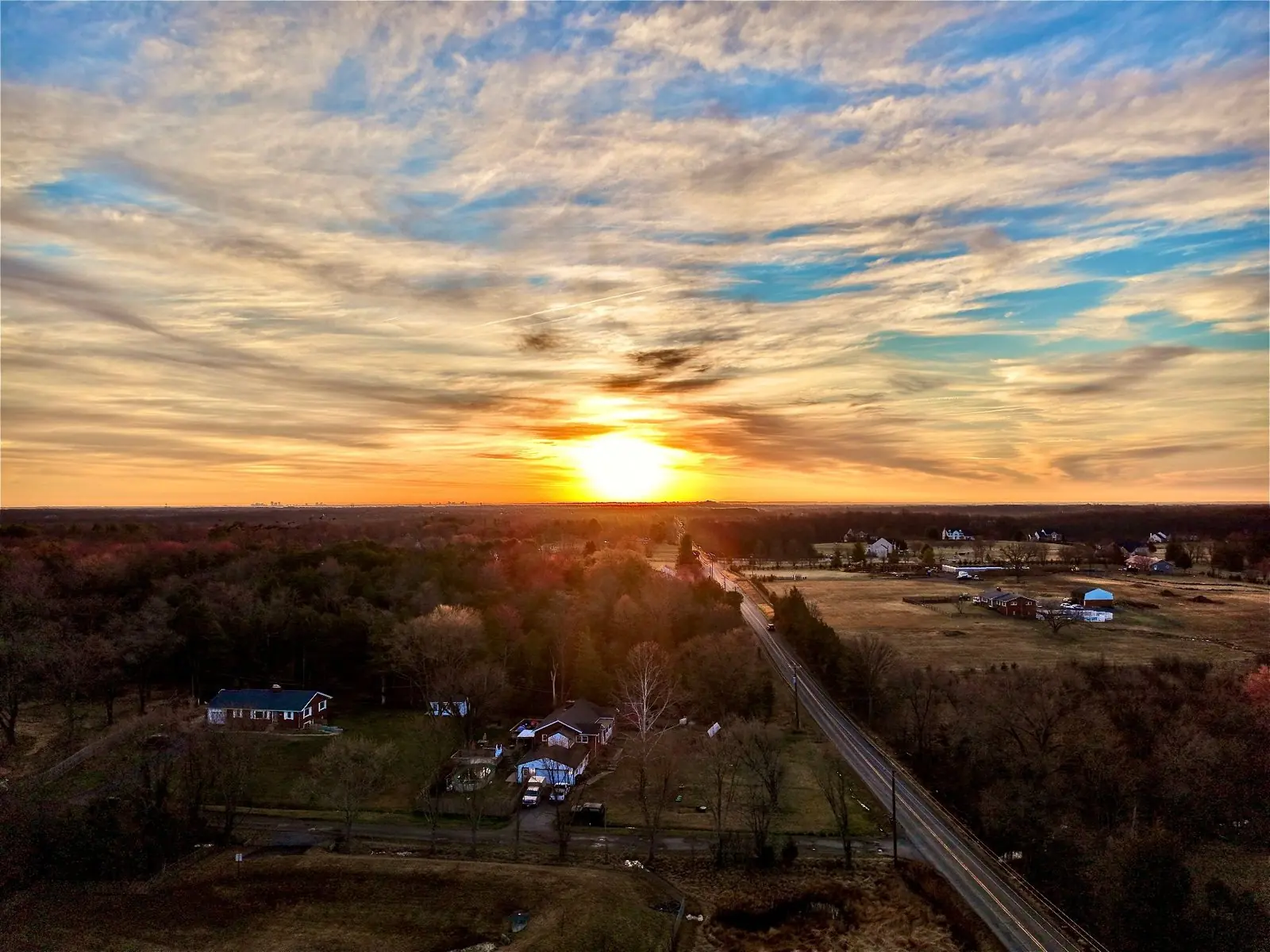 Aerial landscape photography of a golden sunrise over rural Richmond, Virginia