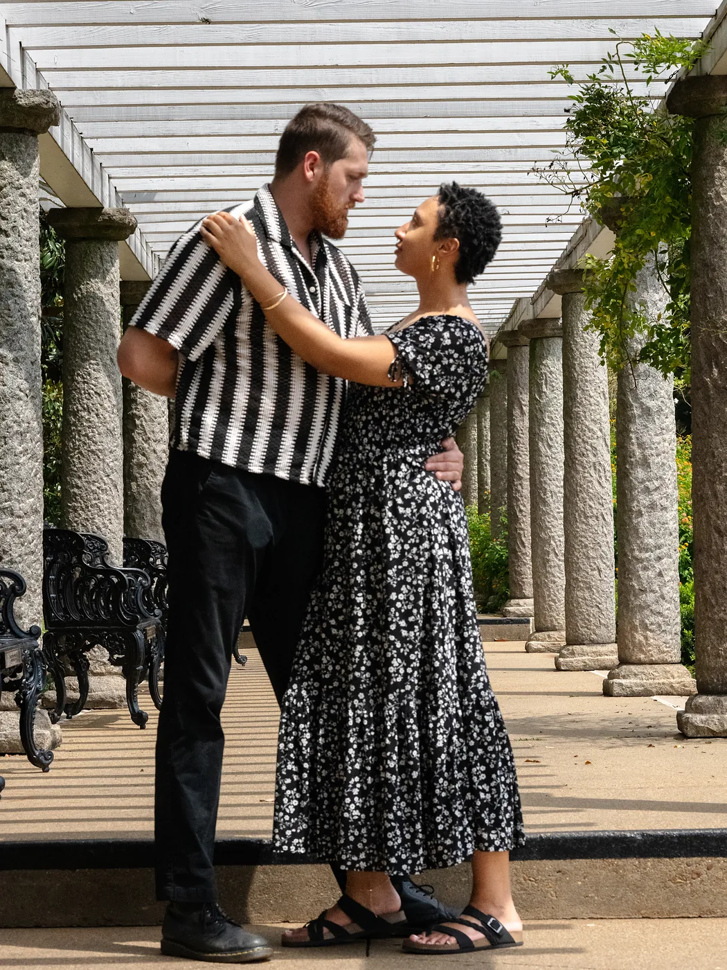 Romantic couples portrait embracing under the Italian Garden colonnade at Maymont, Richmond Virginia